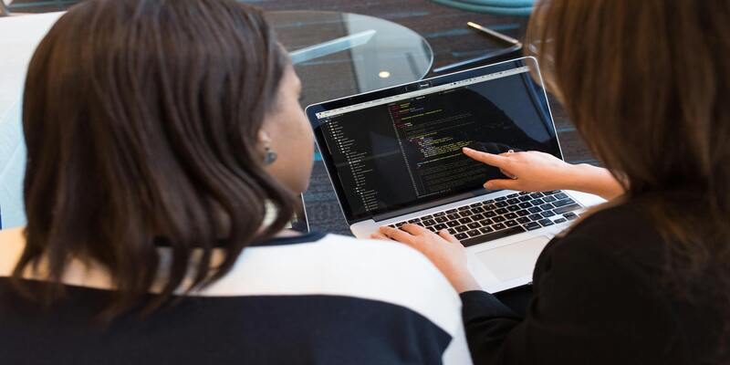 A person pointing at a computer screen AI-generated content may be incorrect.