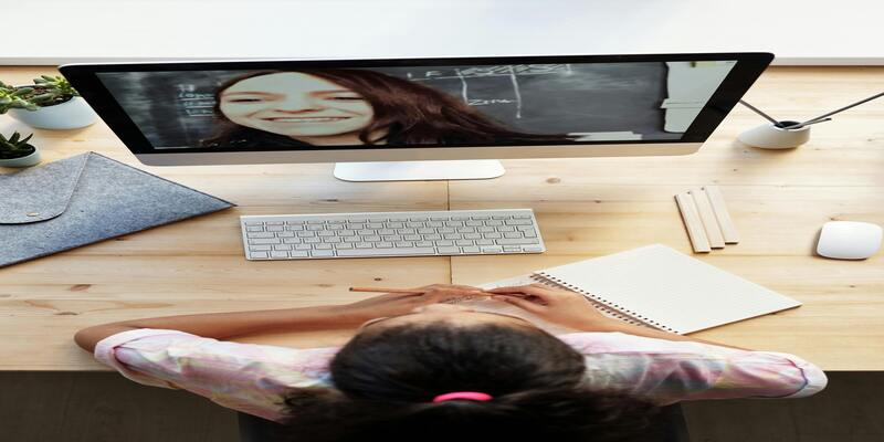 A person looking at a computer screen AI-generated content may be incorrect.
