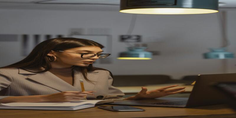 A person sitting at a desk AI-generated content may be incorrect.