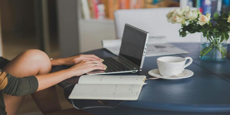 A person using a computer AI-generated content may be incorrect.